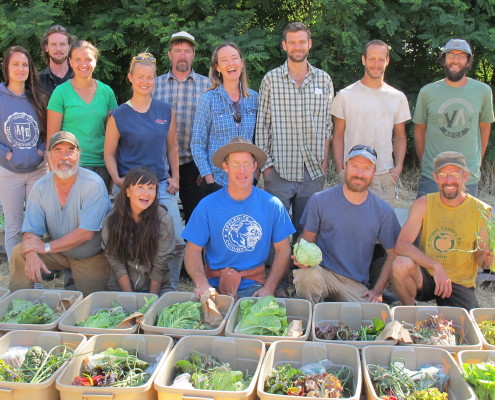 Siskiyou Sustainable Cooperative during one of their pack down days, posing with the vegetable boxes.
